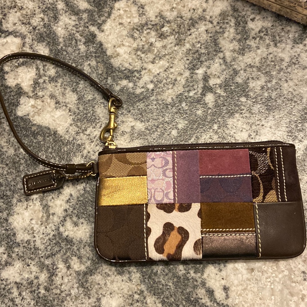 Purple and gold Coach wristlet